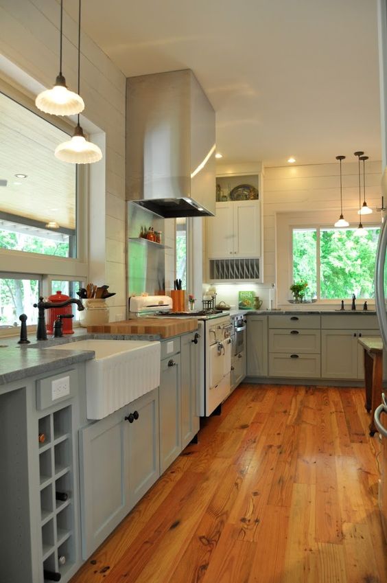 Kitchen with blue cabinets and wood flooring