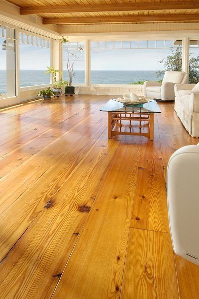 4 season room with pine flooring and views of water