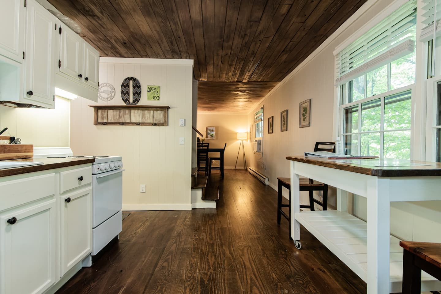 Kitchen space with dark wood floors