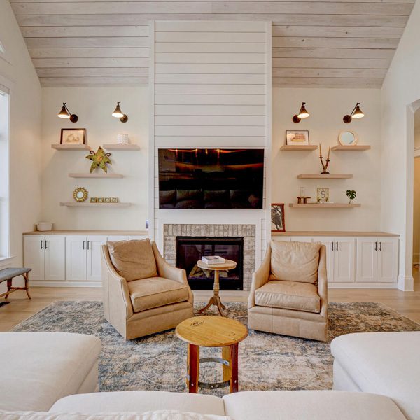 Room with white shiplap ceiling and fireplace